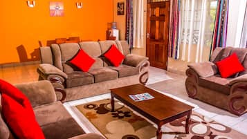 Executive Apartment | Living room | 43-inch Smart TV with digital channels, Netflix, MP3 dock