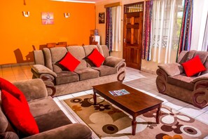 Executive Apartment | Living room | 43-inch Smart TV with digital channels, Netflix, MP3 dock