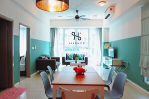 SA#03 - 2-Bedroom for 6 Pax [Tower 2] | Living area | 32-inch LED TV with cable channels - Homesuite' Home at Sutera Avenue (Kota Kinabalu)