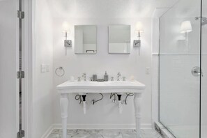 Shower, hair dryer, towels, shampoo