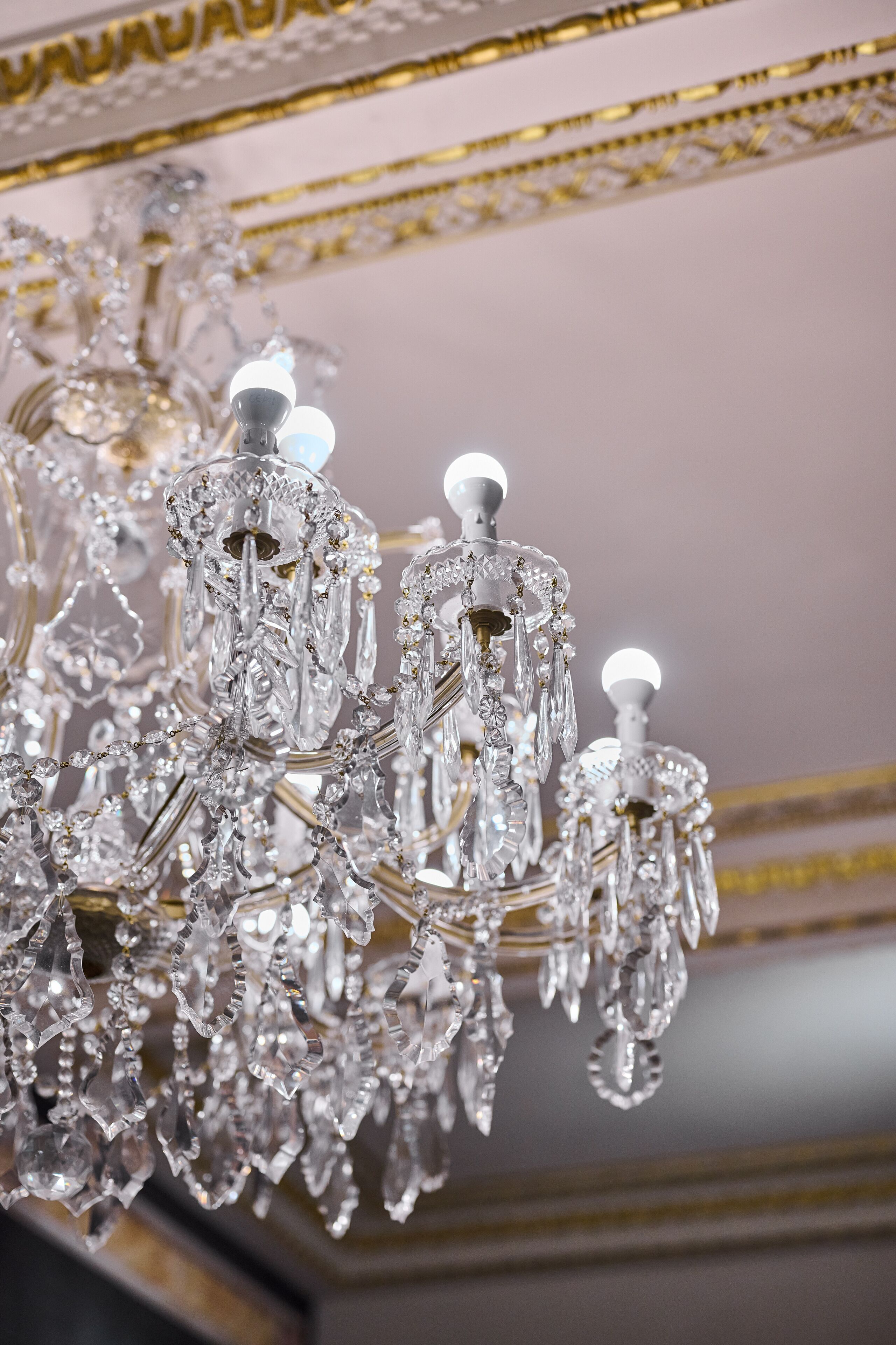 A chandelier with multiple crystal elements and light bulbs.