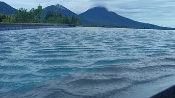 A view of a body of water with mountains in the background.