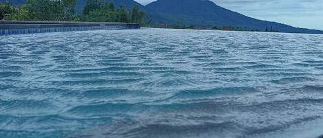 A view of a body of water with mountains in the background.