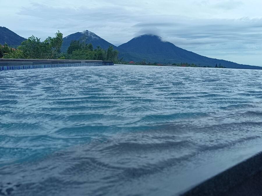 A view of a body of water with mountains in the background.