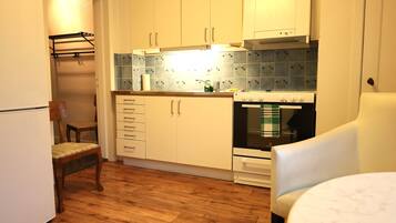 Standard Apartment | Private kitchen | Fridge, microwave, oven, stovetop