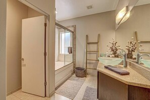 A modern bathroom with a glass shower enclosure, a wooden ladder, and a granite countertop with a towel. - Lofts 7 C Summary:<br>Di (Brian Head)