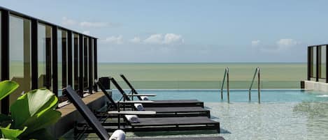 Outdoor pool, open 8:00 AM to 10:00 PM, pool umbrellas, sun loungers