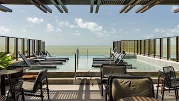 Outdoor pool, open 8:00 AM to 10:00 PM, pool umbrellas, pool loungers