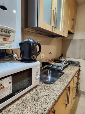 Apartemen | Dapur pribadi | Lemari es, microwave, oven, dan penanak nasi