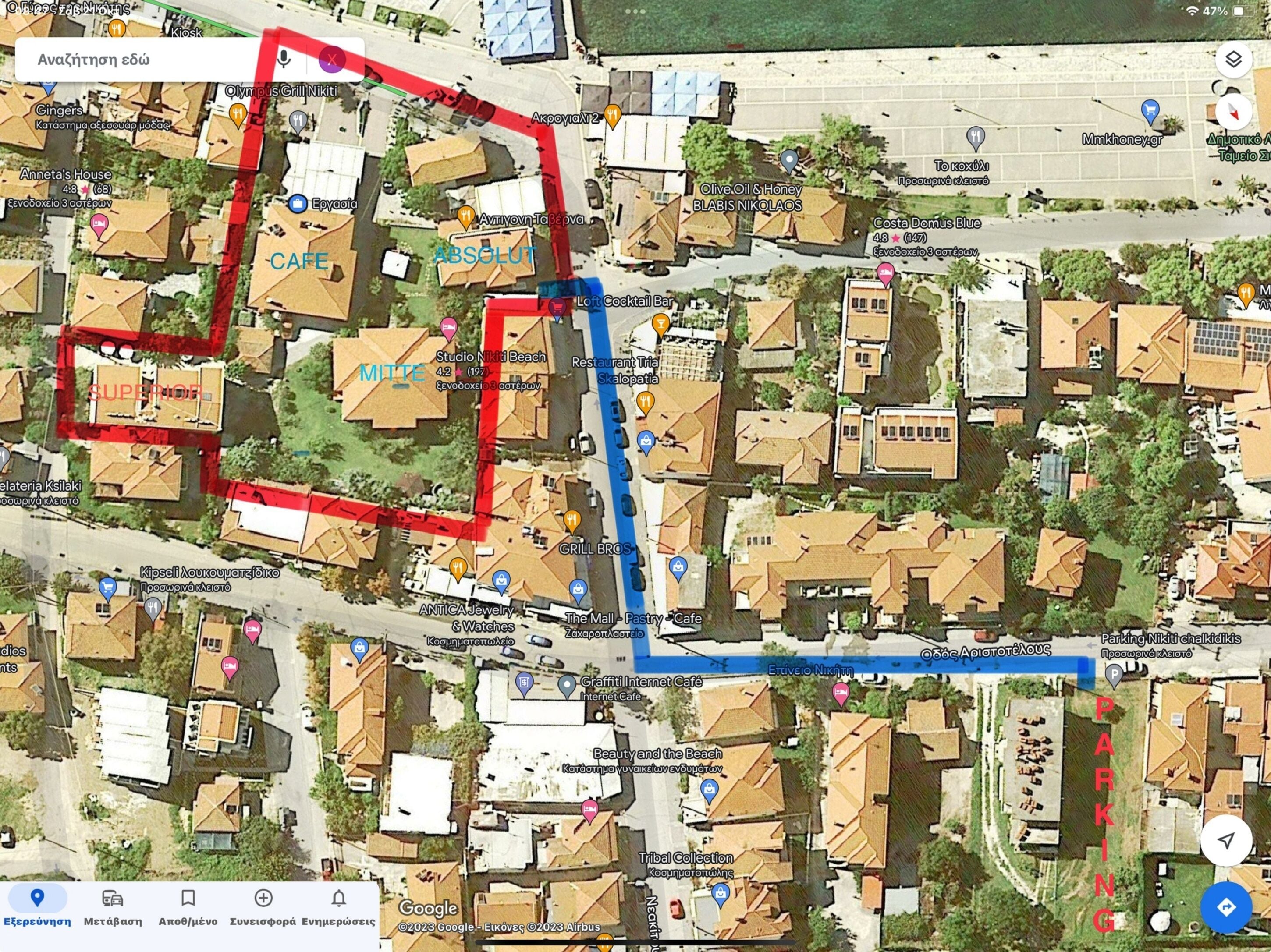 Un mapa con ubicaciones marcadas que incluyen 'Olive Oil & Honey', 'Studio Nikiti Beach' y 'The Mall - Pastas Cafe'.