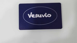 A white surface with a dark blue rectangular label featuring the word "Vesuvi" in white letters. - GRADINI PARTENOPEI (Naples)