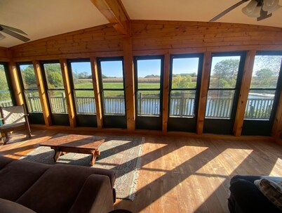 Rustic and Secluded 1 Bedroom Cabin Retreat. Located on Private Stocked Pond.