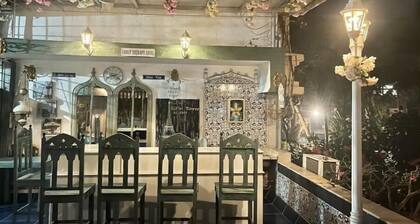 Pvt entry Swiss Chalet Biker’sPlace facing huge terrace sit out.