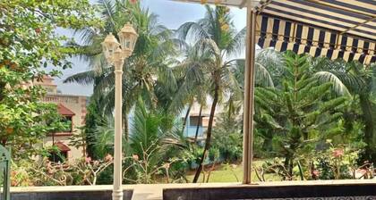 Pvt entry Swiss Chalet Biker’sPlace facing huge terrace sit out.