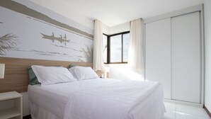 A bedroom with a bed, a nightstand, a window with curtains, and a wall mural. - Iloa Residence Resort Para 4 Pessoas by MME (Barra de São Miguel)