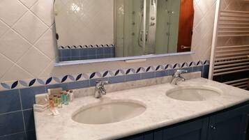 Shower, free toiletries, hair dryer, slippers