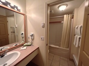 Combined shower/tub, hair dryer, towels, soap