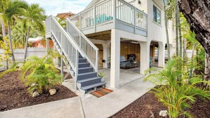 A two-story house with a covered patio, a staircase, and a pool area. - Sea Glass Secrets by Avantstay 3 Mins to Beach (Key West)