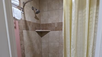 Rainfall showerhead, towels, soap, shampoo