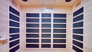 A sauna room with wooden walls and a large glass door. - Winter fun near Big Boulder Mountain! (Lake Harmony)
