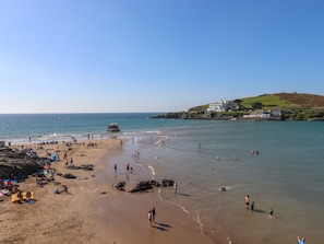 A beach with people and a lifeguard tower. - 4 Burgh Island Causeway (Kingsbridge)