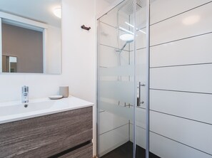 Shower, hair dryer, towels, toilet paper