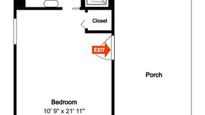Een plattegrond van een hotelkamer met een terras, een slaapkamer van 3,25 meter bij 6,40 meter, een badkamer, een inloopkast en een vluchtwegbord.