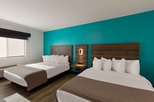 Premium bedding, desk, laptop workspace, iron/ironing board