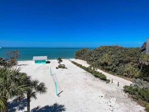 On the beach, sun loungers, beach towels