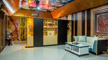 Executive Suite | Living area | 45-inch LED TV with satellite channels