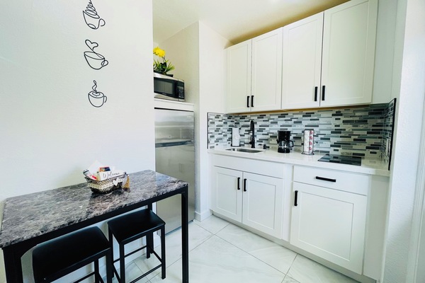 Fridge, microwave, stovetop, coffee/tea maker