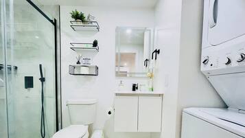 Shower, hair dryer, towels, soap