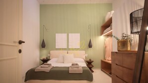A neatly arranged bedroom with a bed, bedside tables, a dresser, and wall-mounted lamps. - TD Casa Brunetti Heart of Historic Center (Monopoli)