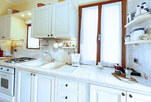 Fridge, oven, dining tables