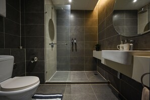 Business Suite | Bathroom | Shower, rainfall showerhead, hair dryer, slippers