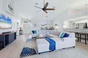 Bright, open living space. Living room features large, comfy sectional sofa and 75" Smart TV - Punta Gorda 3-Bedroom Canalfront Pool Vacation Home with Dock (Punta Gorda)