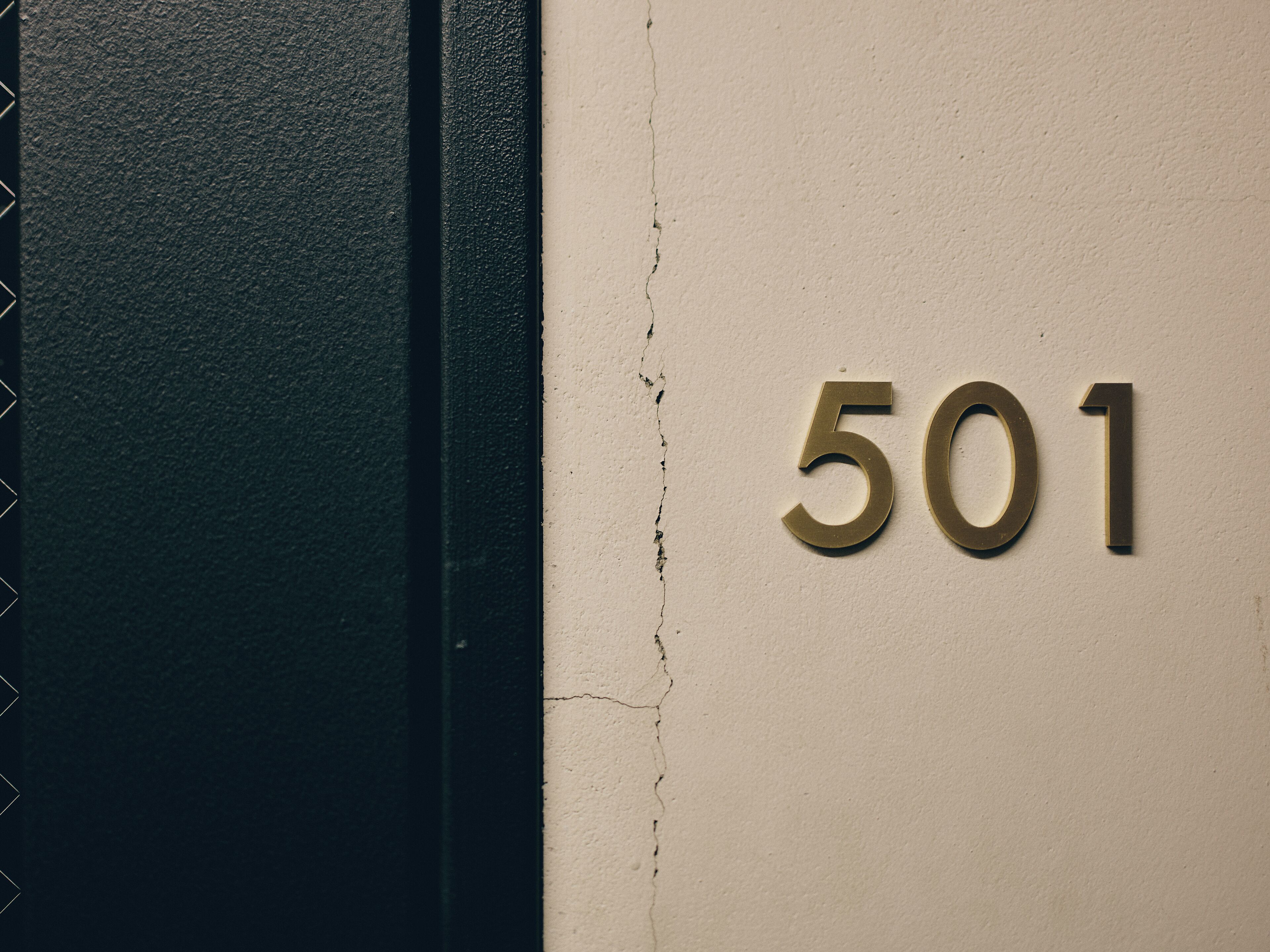 A wall with the number 501, indicating a room number.