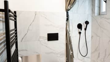 Shower, hair dryer, towels, shampoo