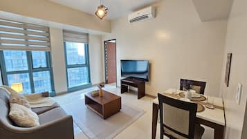 Comfort Condo | Living area | 50-inch Smart TV with digital channels, Netflix, streaming services
