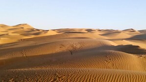 A desert landscape with undulating sand dunes. - Qiemo Tazhong Town Moqin Jiayuan Express Hotel (Qiemo)