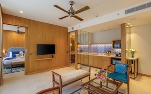Astor Suite - Pool View | Living area | 43-inch flat-screen TV with cable channels, TV