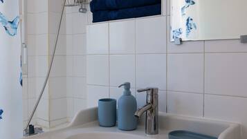 Hair dryer, towels, soap, toilet paper