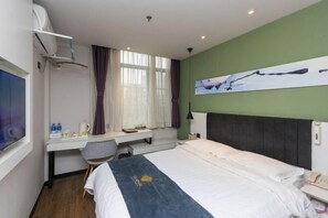 A hotel room with a bed, a desk with a chair, a window with curtains, a painting on the wall, and a telephone on the bedside table. - Super 8 Hotel (Suzhou Jinfeng Road Subway Station Yushan Road) (Suzhou)