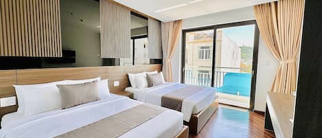 Hypo-allergenic bedding, pillow-top beds, free minibar items, desk