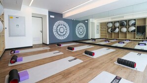 A yoga studio with mats, yoga wheels, and mirrored walls. - w* | Captivating 1BR in San Isidro (San Isidro)