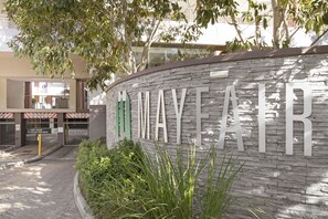 A building entrance with a sign reading "MAYYEARF". - Mayfair Luxury 212 (Cape Town)