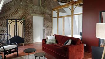 Family Quadruple Room | Living area | Flat-screen TV