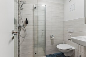 Shower, eco-friendly toiletries, hair dryer, towels