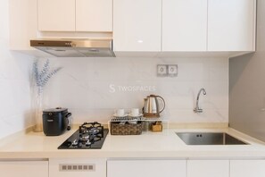 Fridge, microwave, stovetop, rice cooker - Nala by TwoSpaces 2BR@Skyhouse Apartment (Pagedangan)
