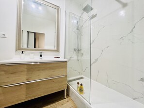 Shower, hair dryer, towels, soap